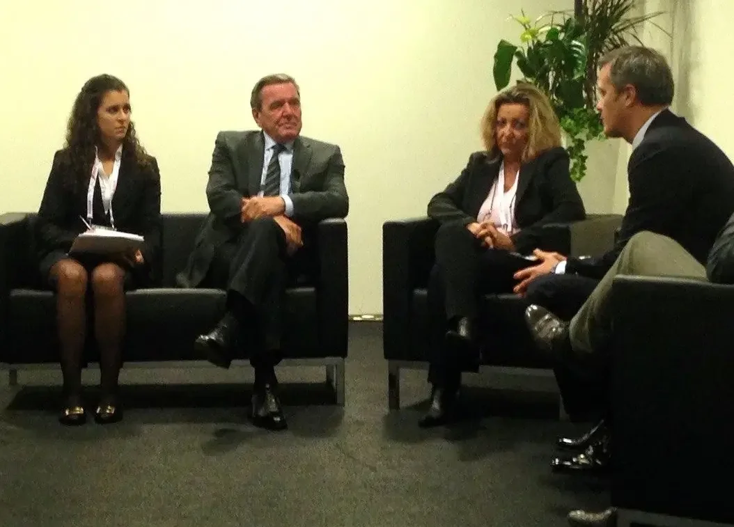 Consecutive interpreter taking notes during a business discussion